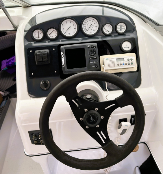 Dashboard with Lowrance GPS fishfinder, radio and trim tab control